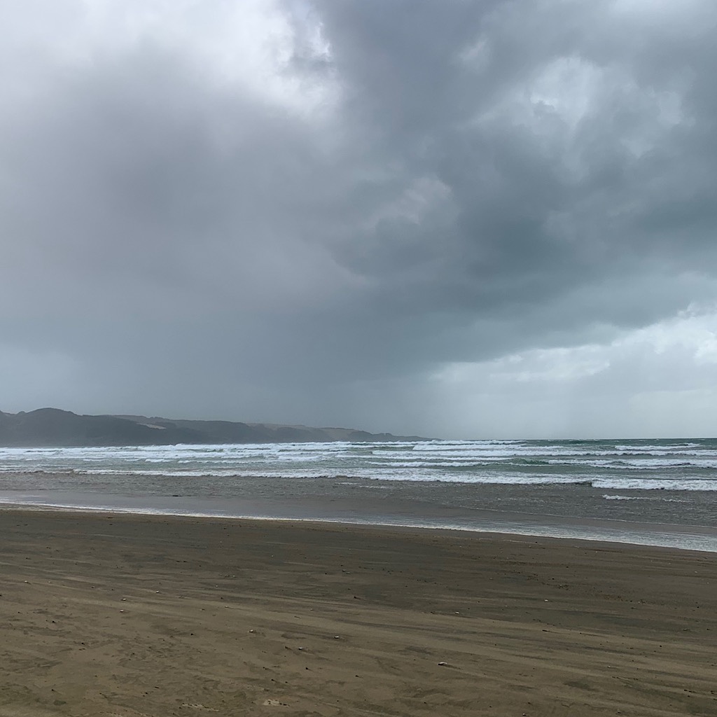 Ahipara is getting closer and the end of the beach as a squall approaches. 