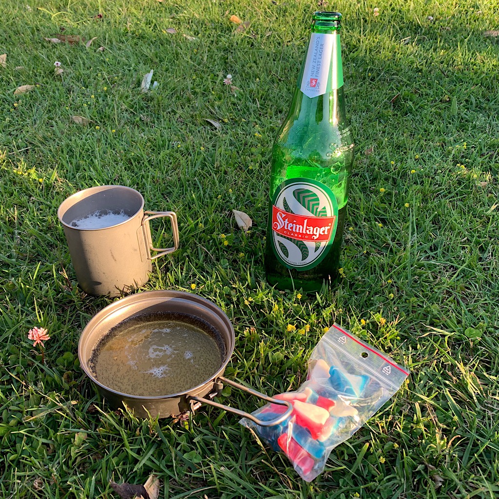 I brought gummies to settle up with Bram from the other night when he gave me all of his,  and he brought Steinlager to share at the beautiful camp spot in Whananaki.