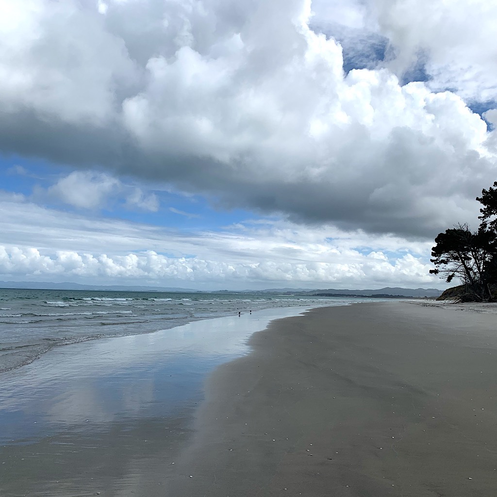 The glorious beach near Ruakaka and clouds that must have looked the same when the islands were named Aotearoa, or "Land of the Lpng White Cloud."