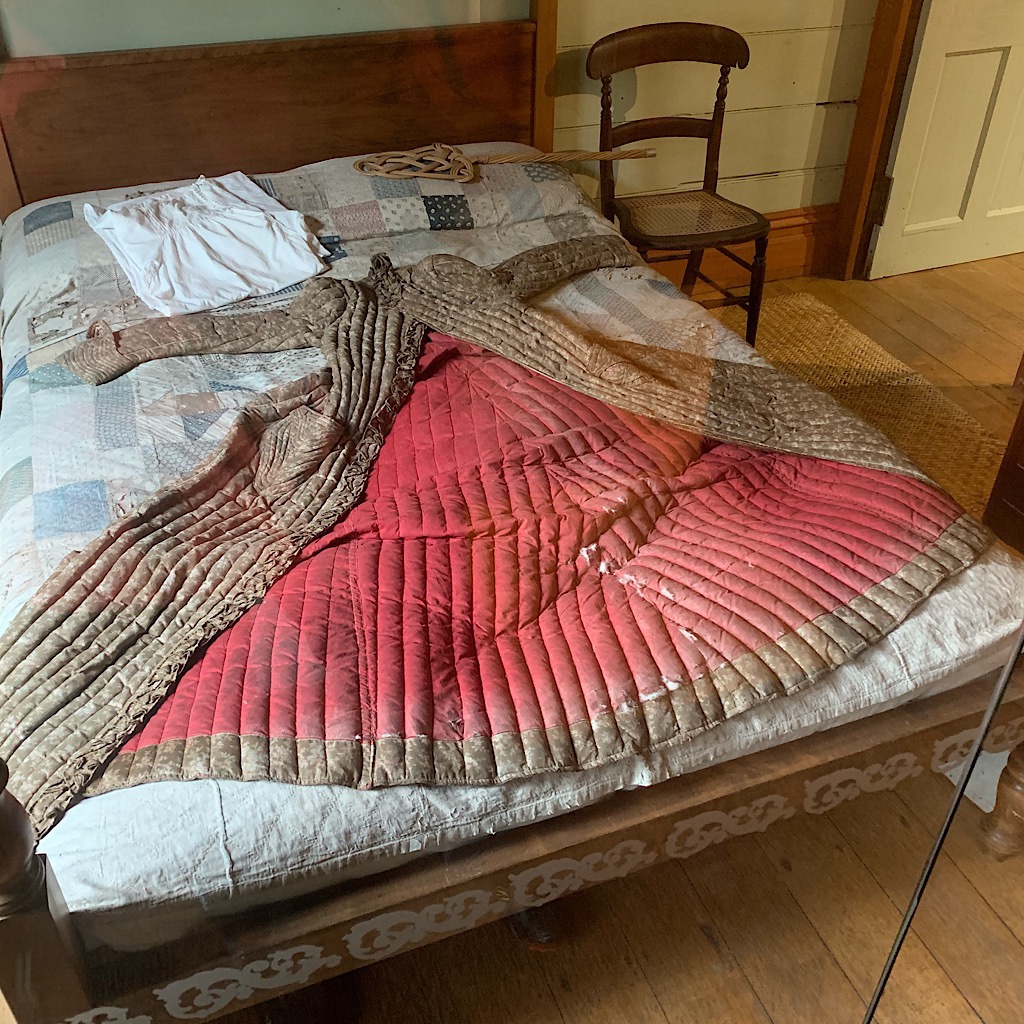 An early example of goose down sewn into baffles in a 19th century coat at the historic Acacia Cottage.