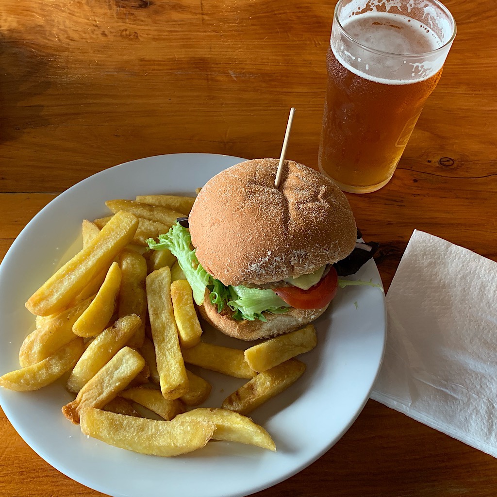 A hamburger and local brew at Curly's Bar in Waitomo. 