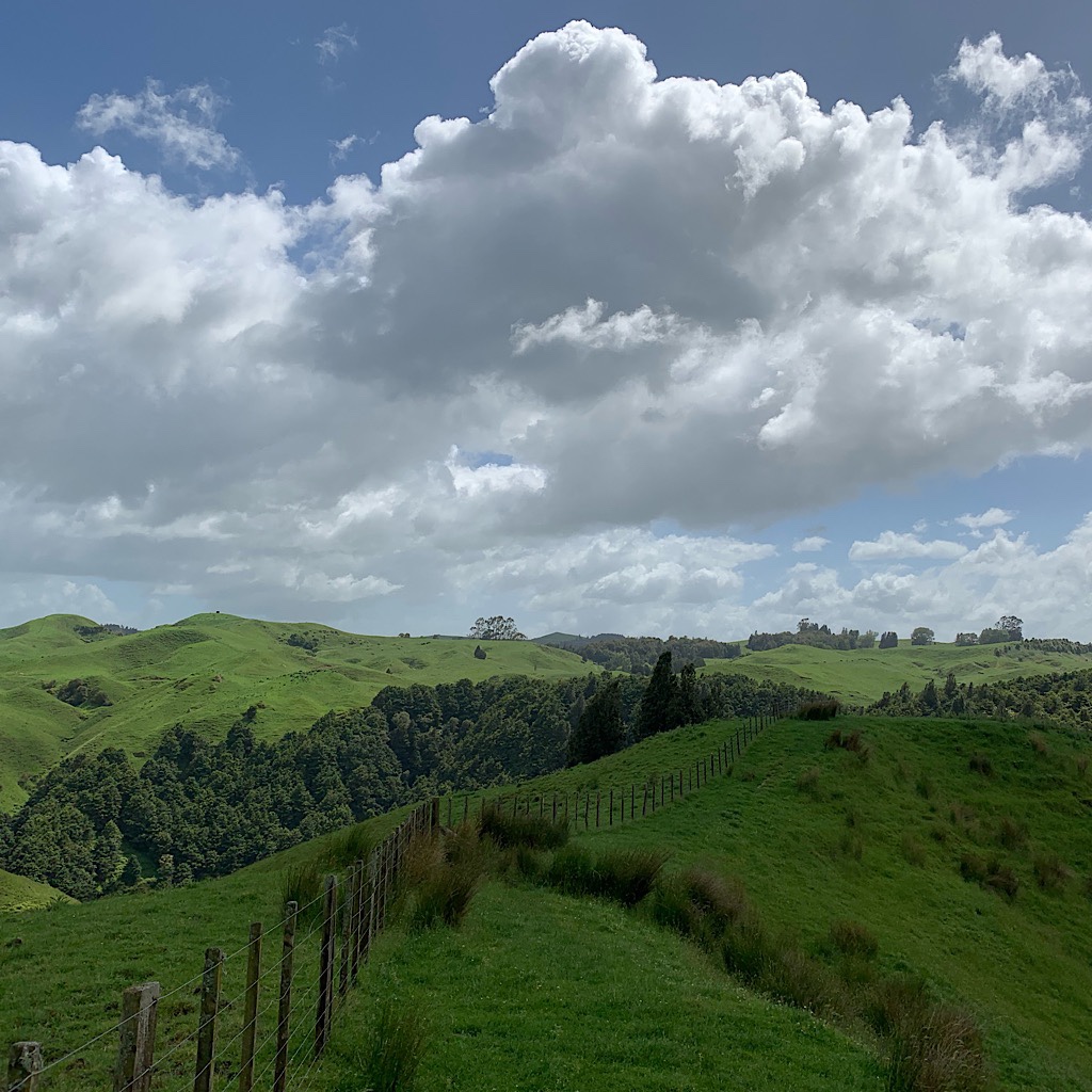 Clouds building over farmland in the King Country region of New Zealand's North Island. 