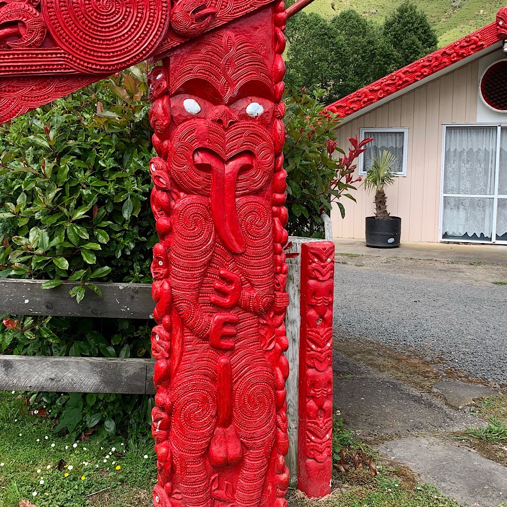 A Toi whakairo – or art carving – at the local Marae of a well endowed creature in the traditional haka pose. 