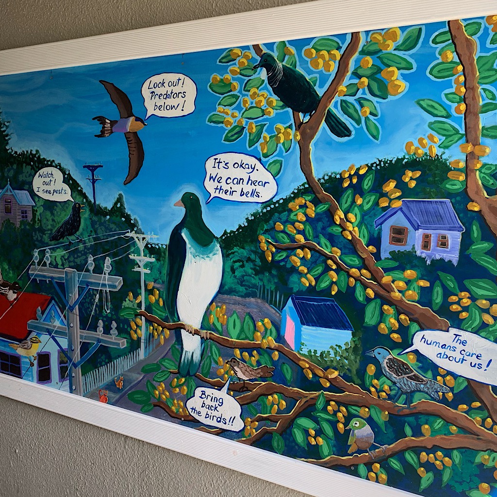 A mural in the tunnel reminding people to put bells on their cat's collars to protect the native birds. 