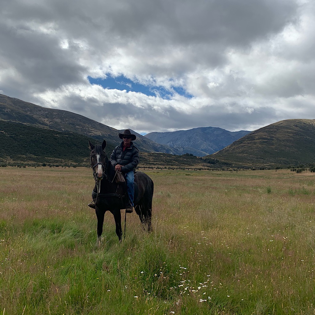 The New Zealand cowboy who told us we needed to hide in the trees until the wild horses came by.
