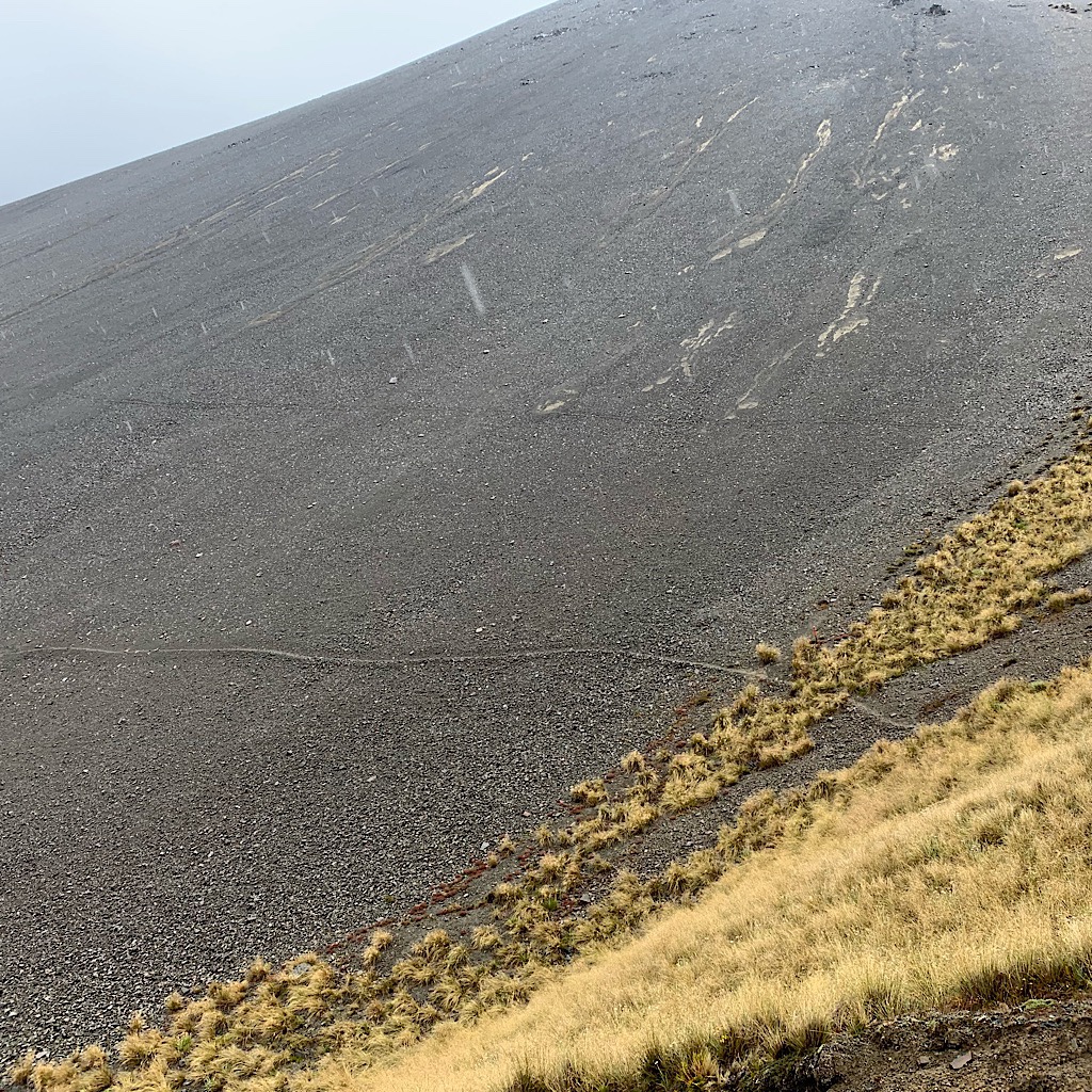 The long sidling track on a mountain of scree. 