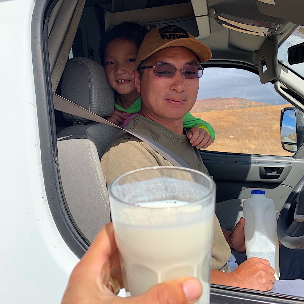 A Chinese family on vacation gave me a glass of milk when I was parched on the road walk. 