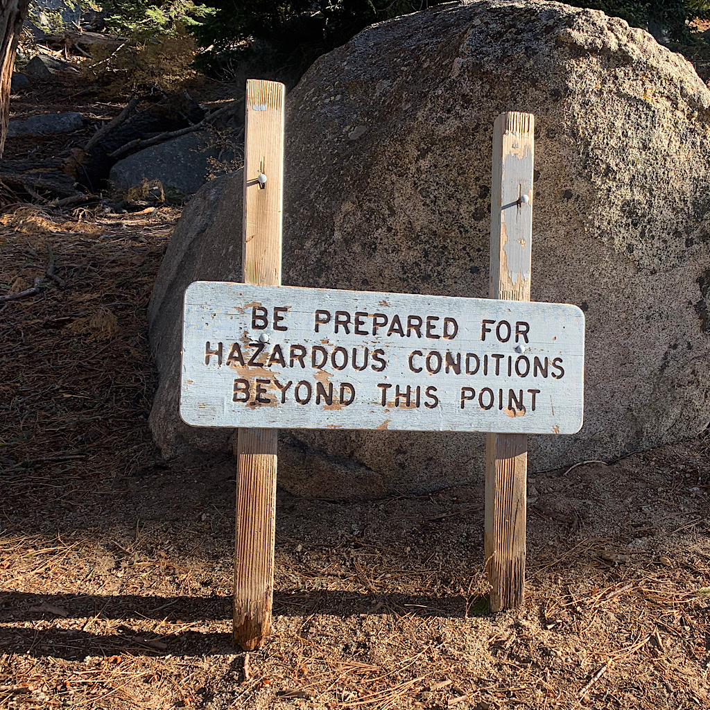 The sign warns of potential hazard as the trail leads above tree line on San Jacinto Peak.