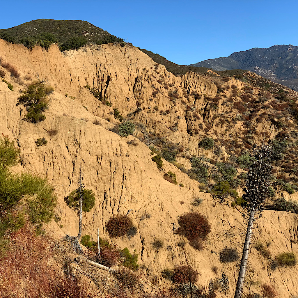 The PCT passes by a "badlands" of eroding mountainside. 