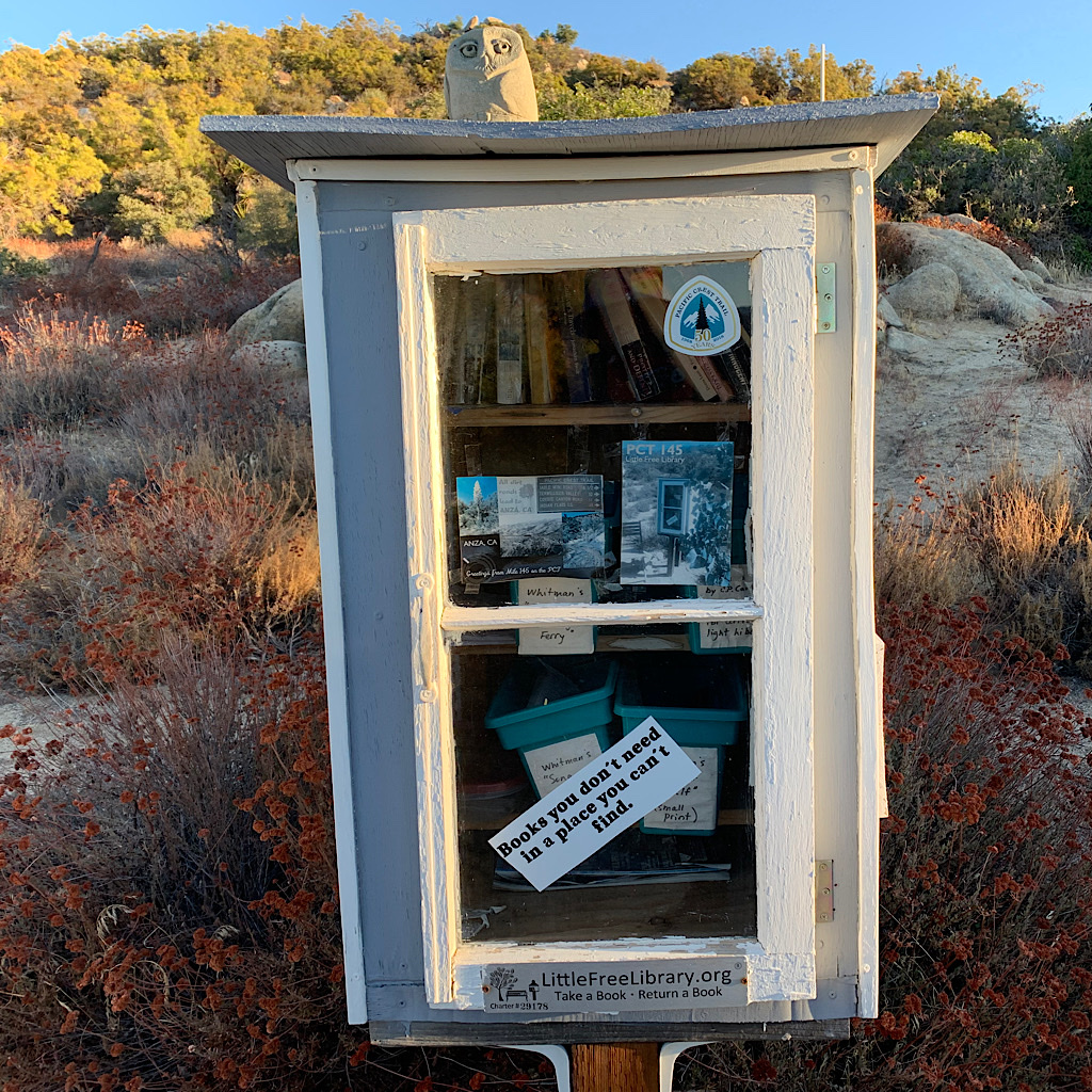 A little free library with literary gems, some in minuscule "ultralite hiker" font.  