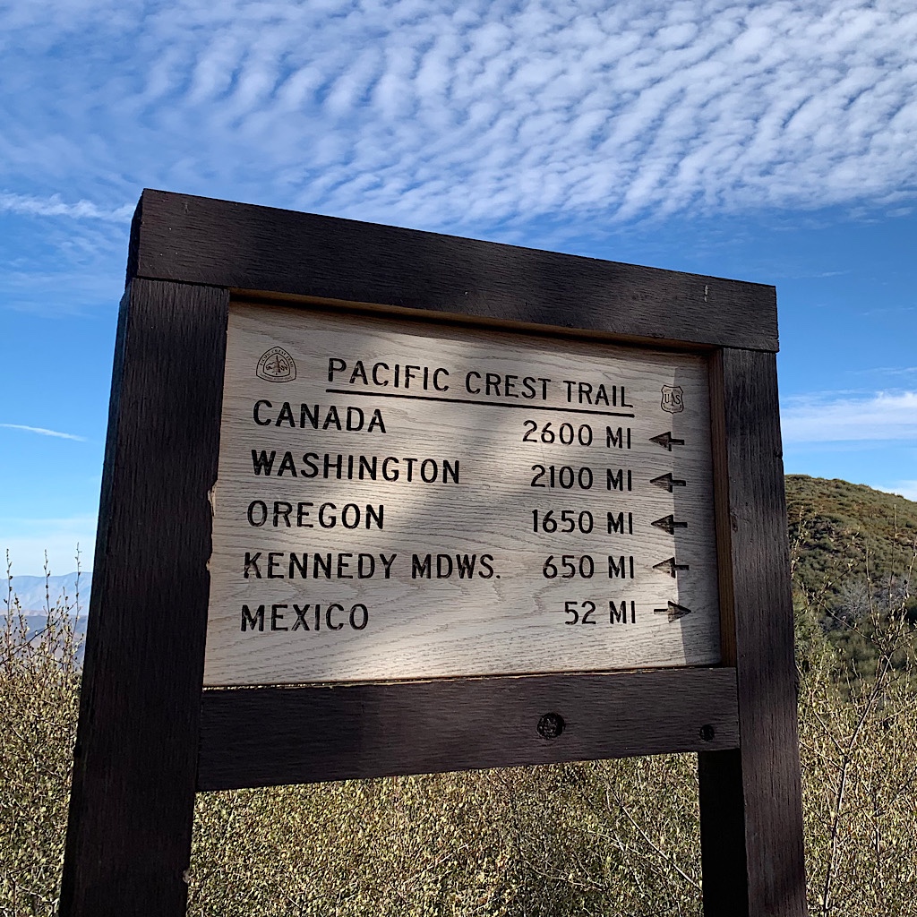 A sign shows me I how far I've come and how far I have to go to finish the PCT.