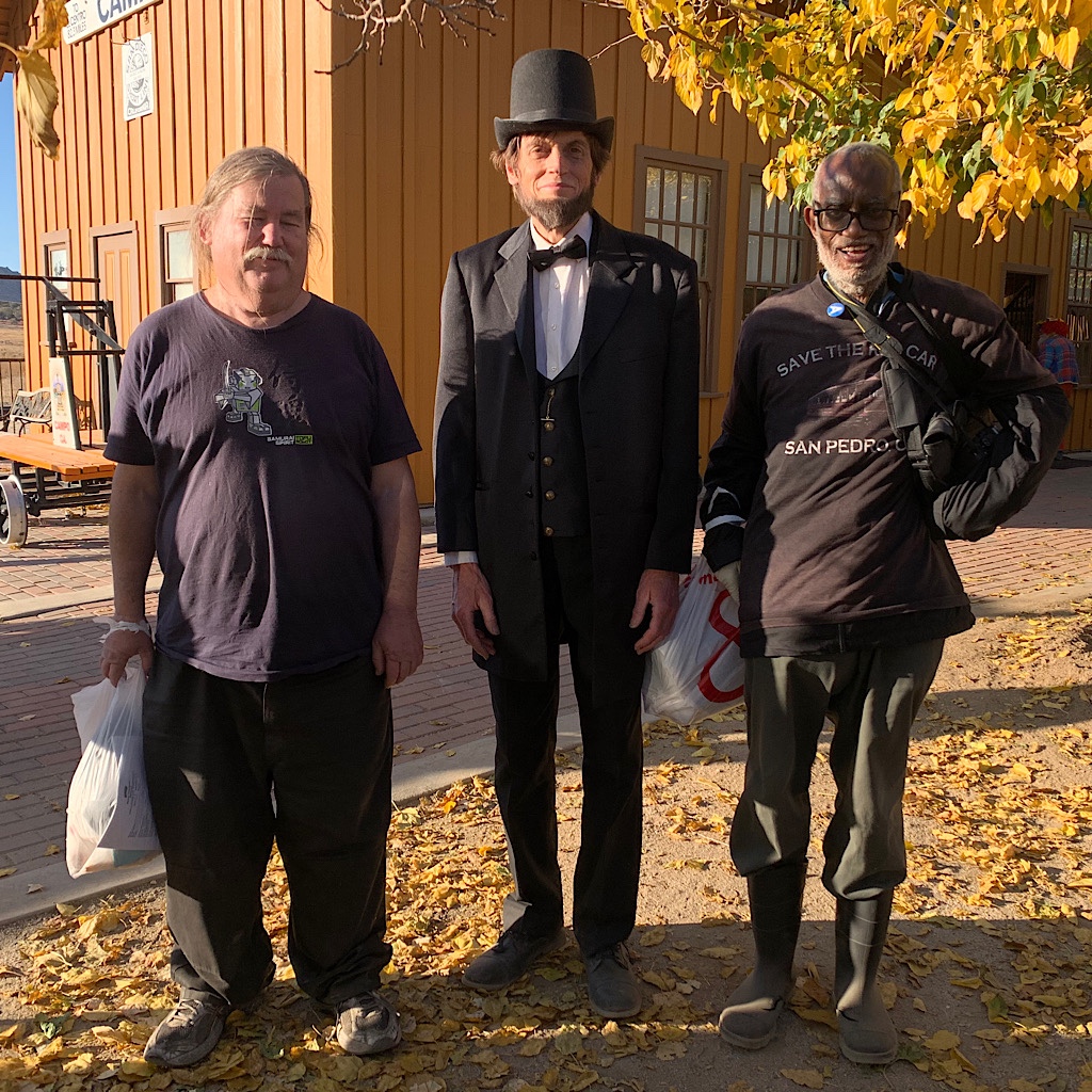 A Lincoln impersonator and friends at the Camp train depot.