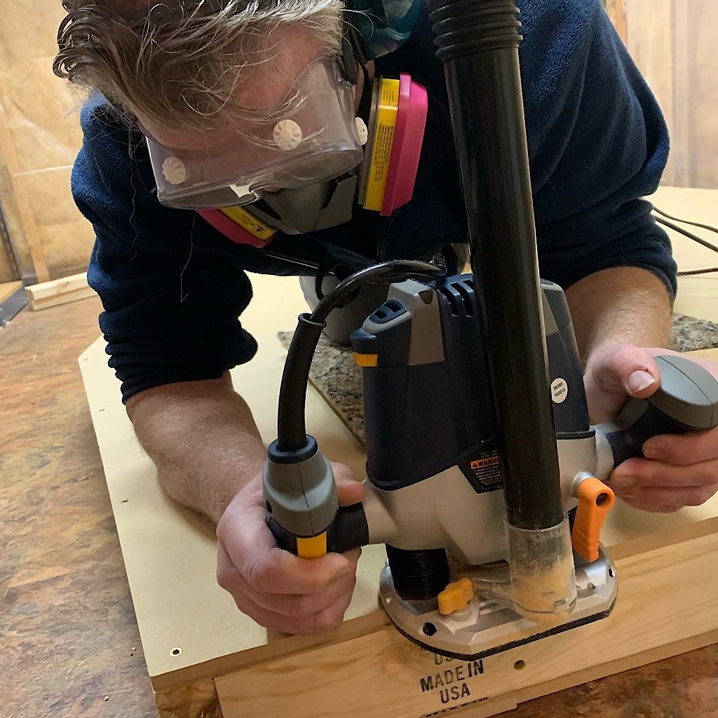 Richard uses a router to smooth the edges and hide mistakes. 