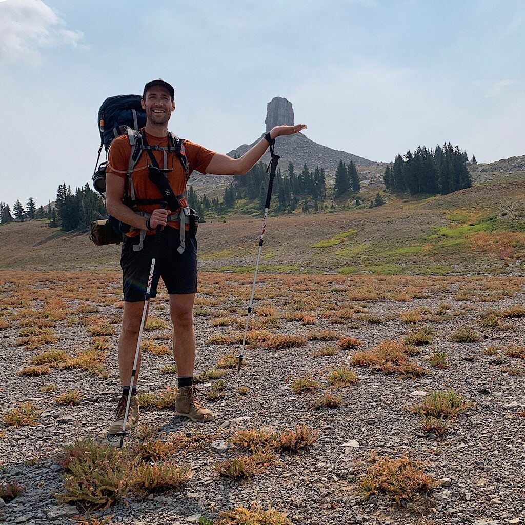 A fellow solo hiker palming Spearhead Peak.