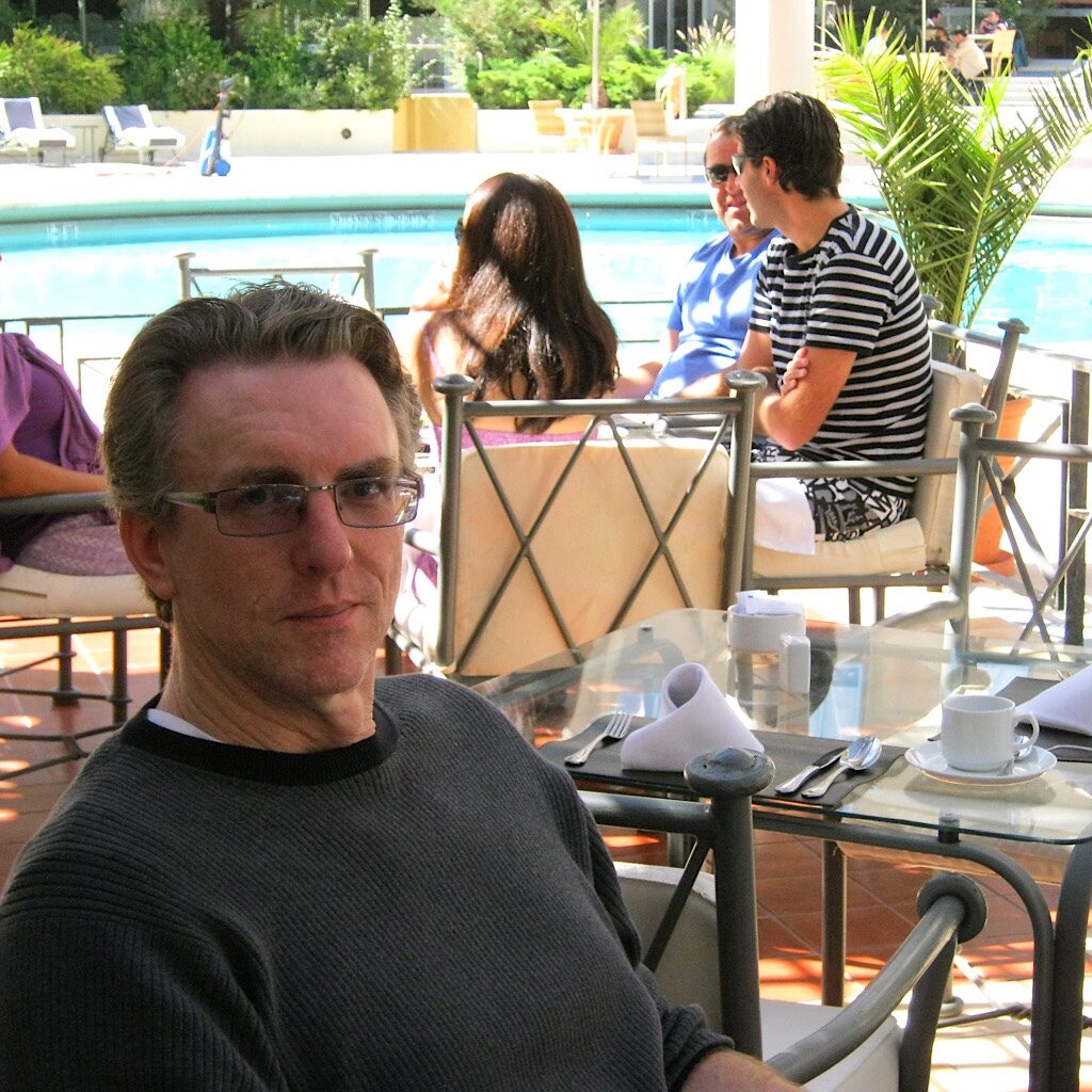 "Mr. Blissful," Richard Rasch at breakfast by the pool in Santiago, Chile. Our hike in Patagonia was delayed by a strike.