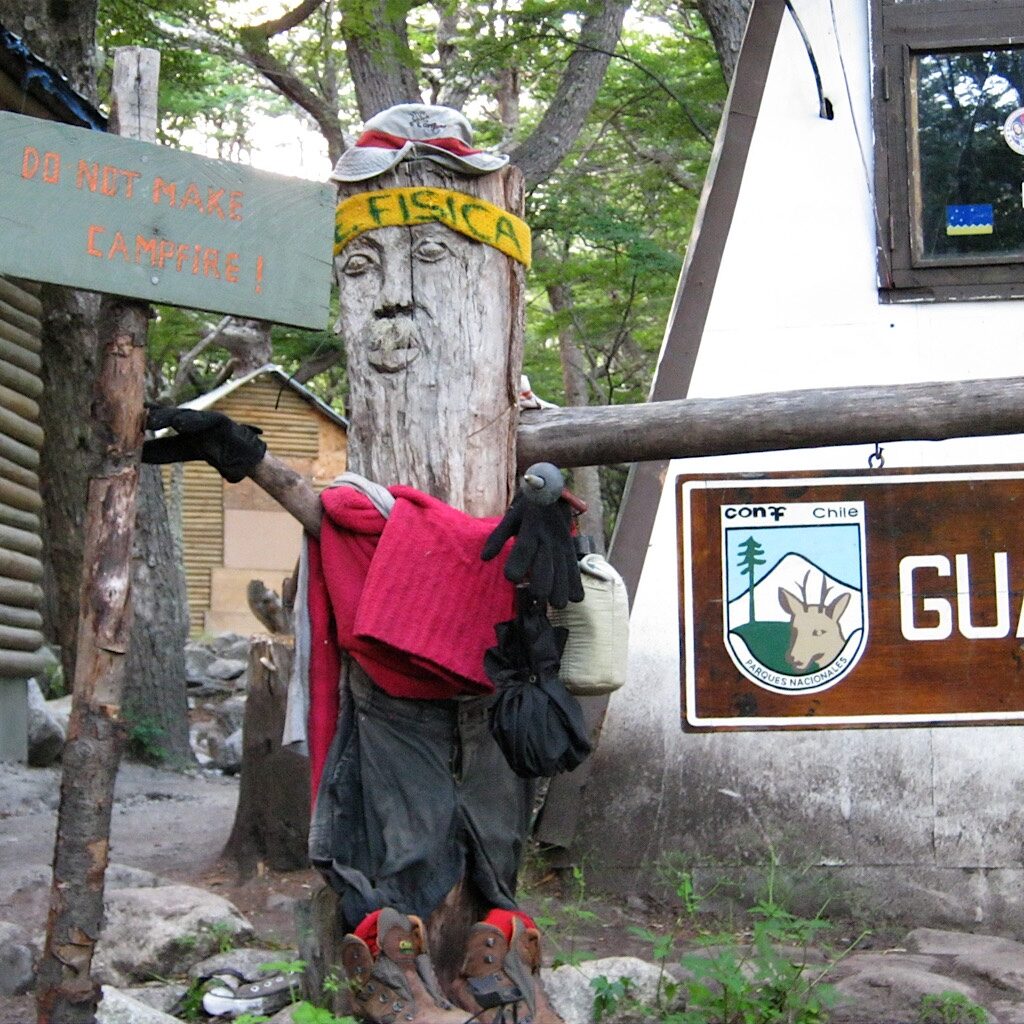 At the guard station, a fanciful sign dressed in lost-and-found clothing warns hikers not to camp here. 