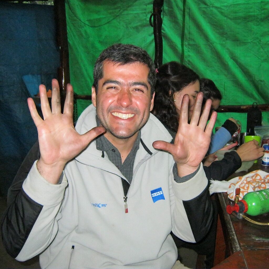 Rodrigo proudly shows his blackened hands after he (with Richard's help) fixed his stove. 