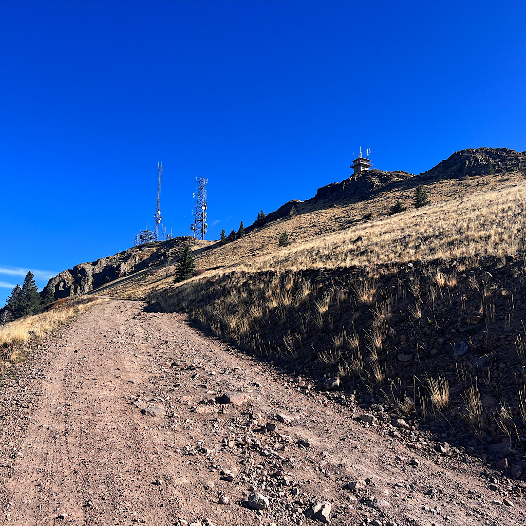 Just when I thought it was time to go down, the trail joined a steep road up to radio towers. 