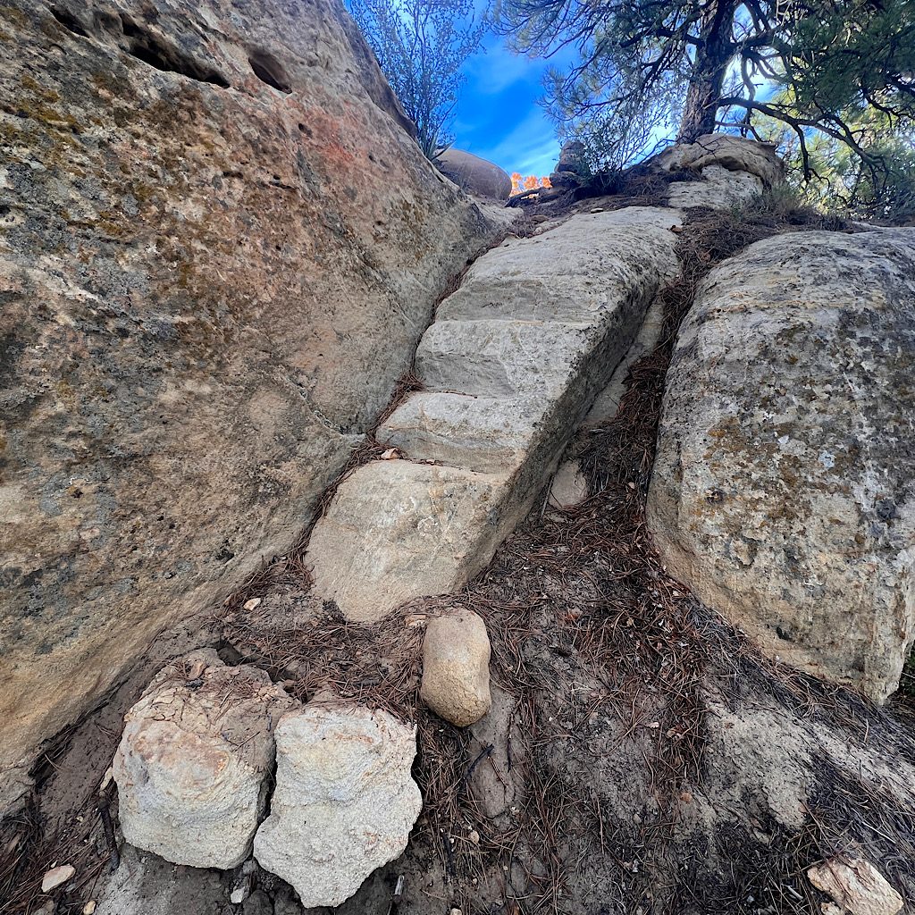 Stairs carved directly in the rock on Mesa Portales. 