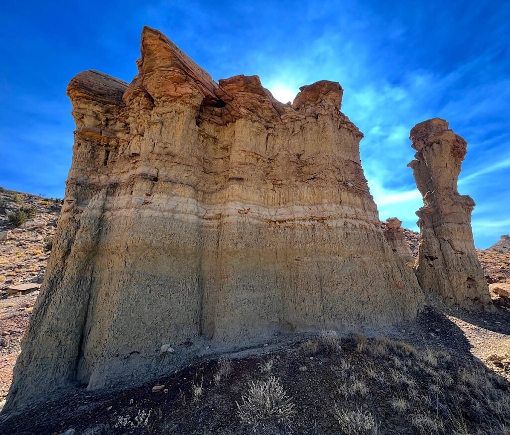 I walk past a series of hoodoos – described as relatively soft sedimentary rock topped by harder, volcanic rock that is less easily eroded and protects each column from the elements. They're curious and interesting, but also whimsical. 
