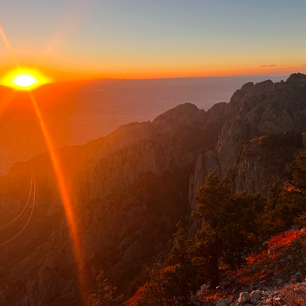 Sunset over Albuquerque from Sandia Peak. The New York Times listed it as one of the best places to see fall colors. The lump in the distance is 11,000-foot Mount Taylor which I climb on the Continental Divide Trail. 