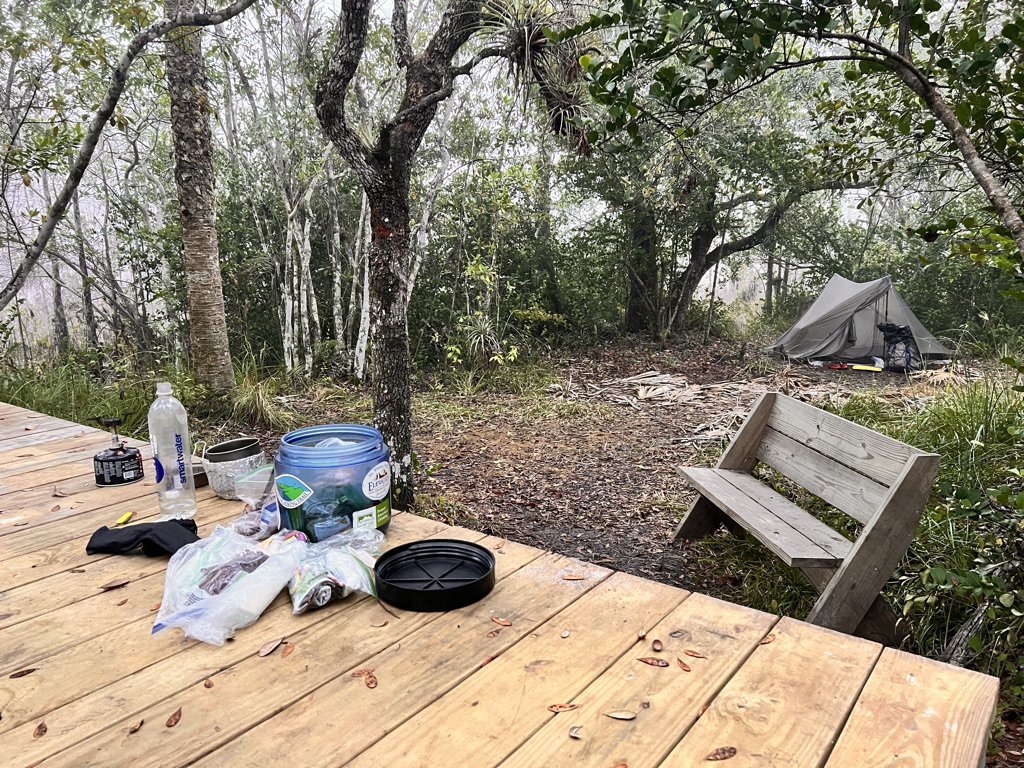 I'm all alone on this tiny oak hammock utterly surrounded by swamp and use the tent platform for cooking.