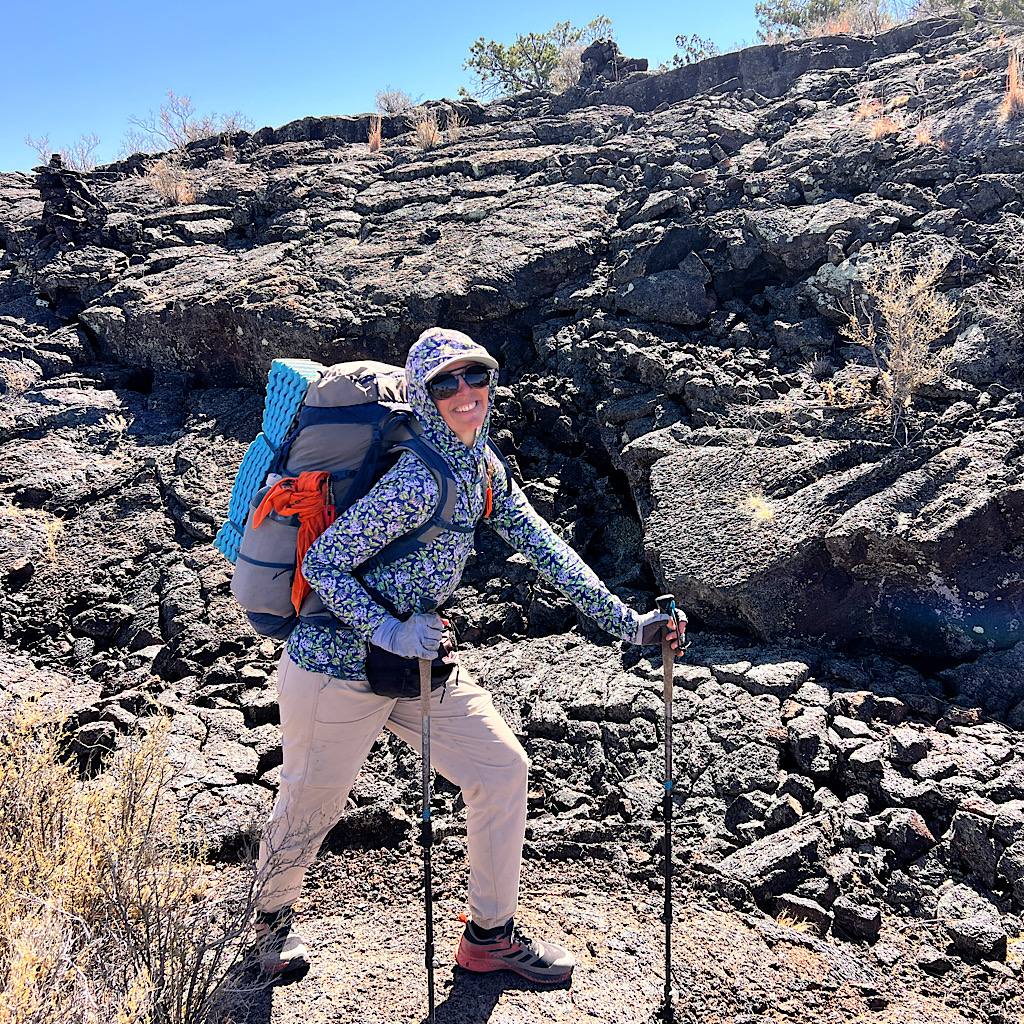 I met a couple on the way who snapped my pic. You can see a cairn over my shoulder leading the way up onto the lava field.